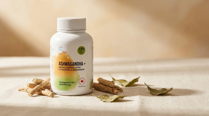 Live 5AM Ashwagandha+ supplement bottle on warm cream linen with fresh ashwagandha root pieces and dried leaves in soft morning light