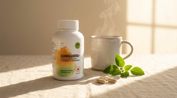 Live 5AM Ashwagandha+ supplement bottle next to a steaming ceramic mug with fresh ashwagandha leaves in morning window light